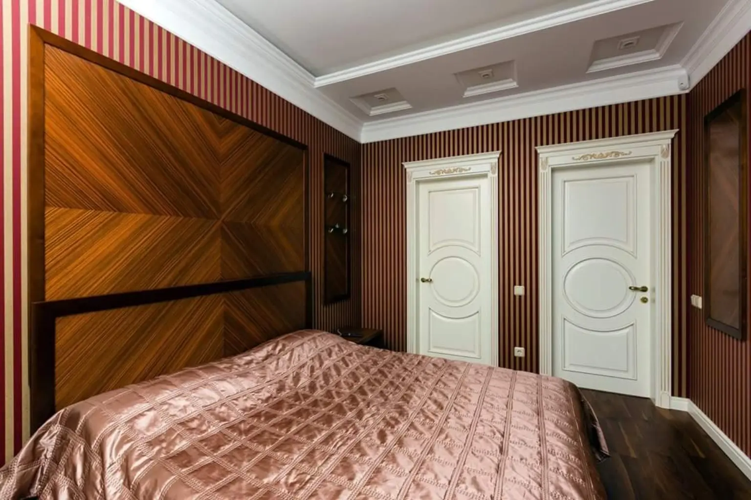 Bedroom with wood wall panels — Overall view